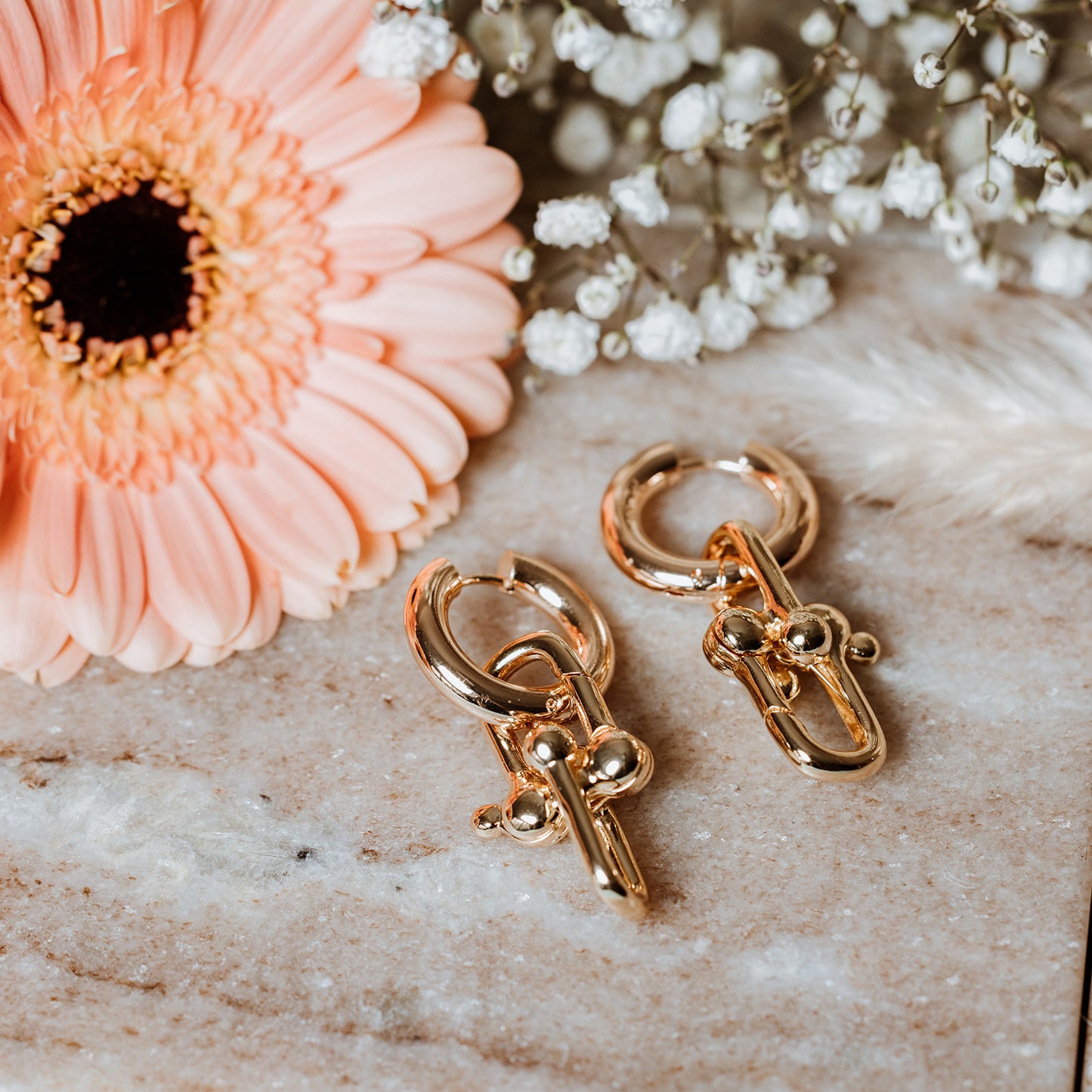 Bold Link Hoop Earrings, woman wearing Bold Link Hoop Earrings, link hoops, bold link earrings, gold earrings.