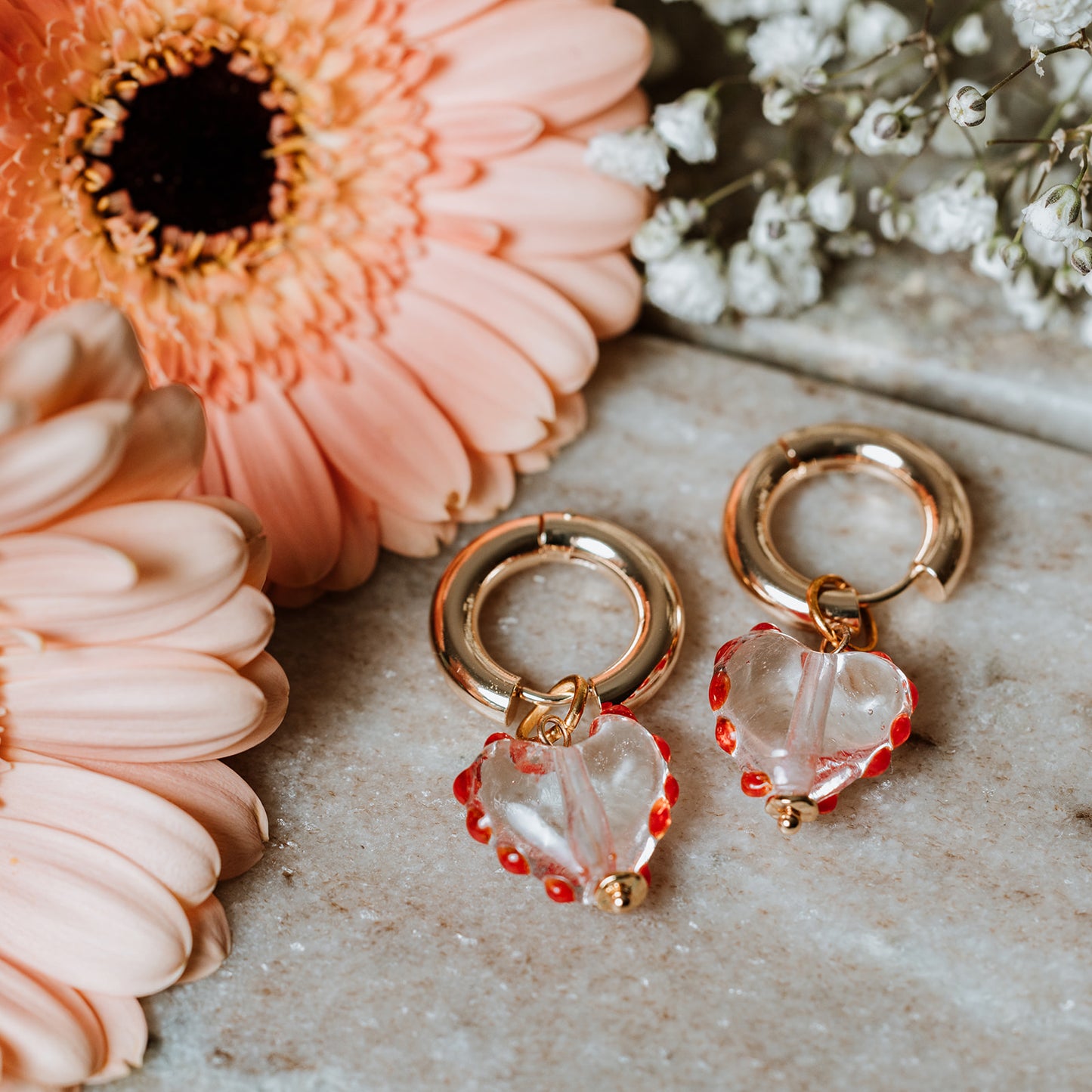 Chunky Gold Hoops with Murano Glass Heart, woman wearing Chunky Gold Hoops with Murano Glass Heart, Murano glass, Murano glass earrings, heart earrings, gold hoops, gold earrings