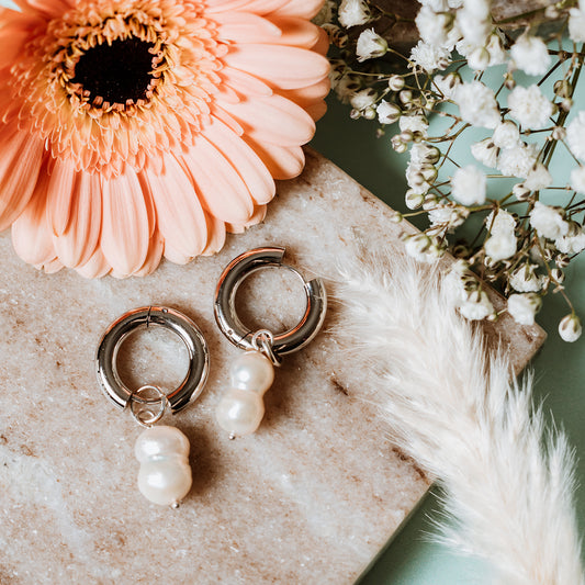 Chunky Hoops with Peanut Pearl, woman wearing Chunky Hoops with Peanut Pearl, peanut pearl, silver hoops, silver chunky hoops, silver earrings, pearl earrings.