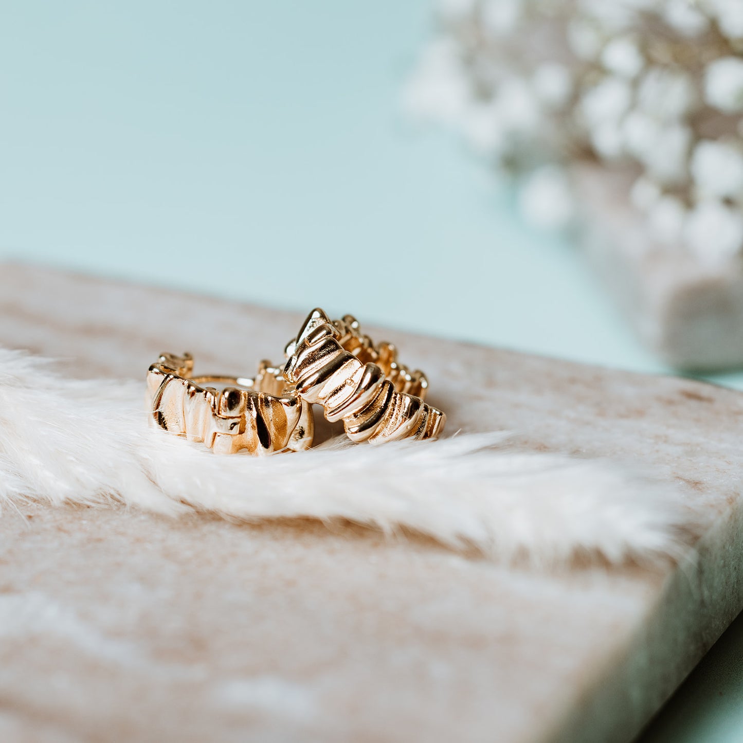 Woman wearing Rippled Gold Hoop Earrings, Rippled Gold Hoop Earrings, gold hoops, gold earrings, rippled earrings, rippled hoops.