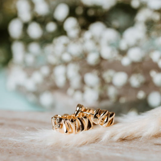 Woman wearing Rippled Gold Hoop Earrings, Rippled Gold Hoop Earrings, gold hoops, gold earrings, rippled earrings, rippled hoops.