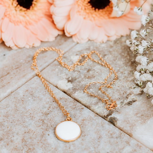 Gold Necklace with White Enamel Coin Charm, gold necklace, white enamel coin charm, white enamel charm, white coin charm, white charm, lady wearing Gold Necklace with White Enamel Coin Charm