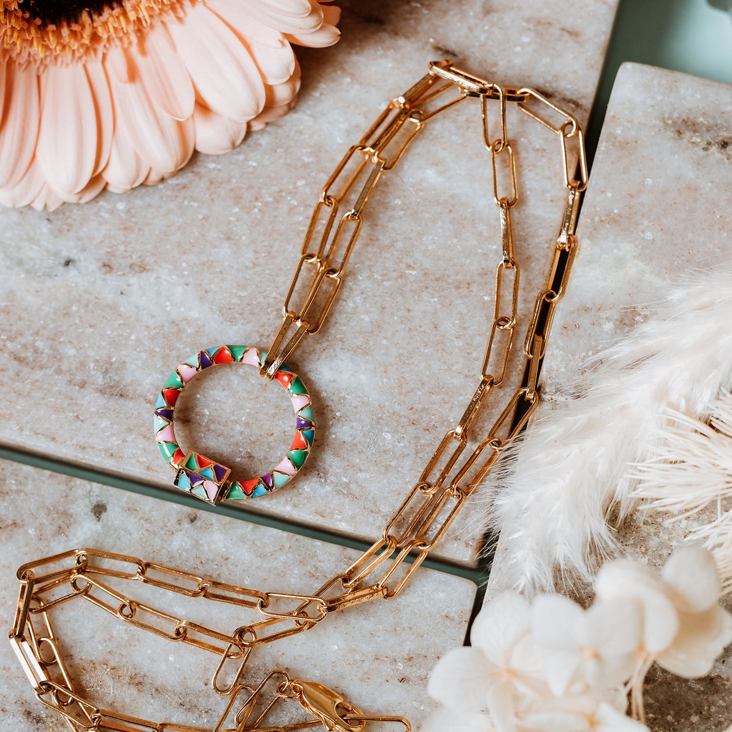 Gold paperclip chain, paperclip chain, enamel carabiner, enamel necklace, bright colour necklace, multicoloured charm, lady wearing gold paperclip necklace with multicoloured enamel carabiner charm