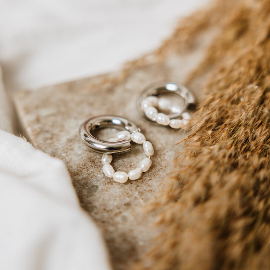Silver hoops with freshwater pearl chain, woman wearing Silver hoops with freshwater pearl chain, pearl earring, pearl chain earring, Bold, silver earrings