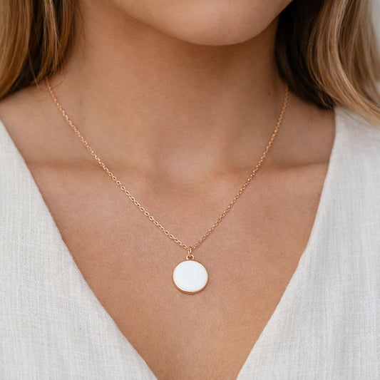 Gold Necklace with White Enamel Coin Charm, gold necklace, white enamel coin charm, white enamel charm, white coin charm, white charm, lady wearing Gold Necklace with White Enamel Coin Charm