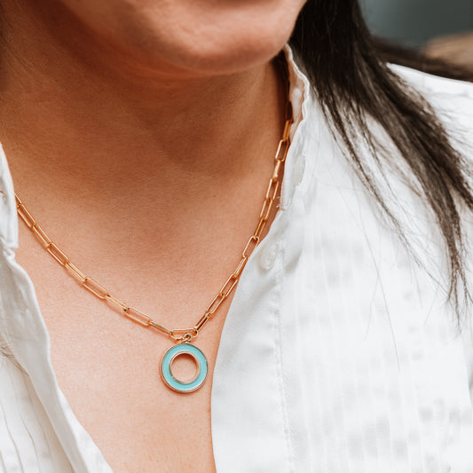 Paperclip chain with Enamel T Bar charm, woman wearing Paperclip chain with Enamel T Bar charm, enamel T-Bar, gold necklace, gold chain, gold charm. turquoise necklace, turquoise charm.