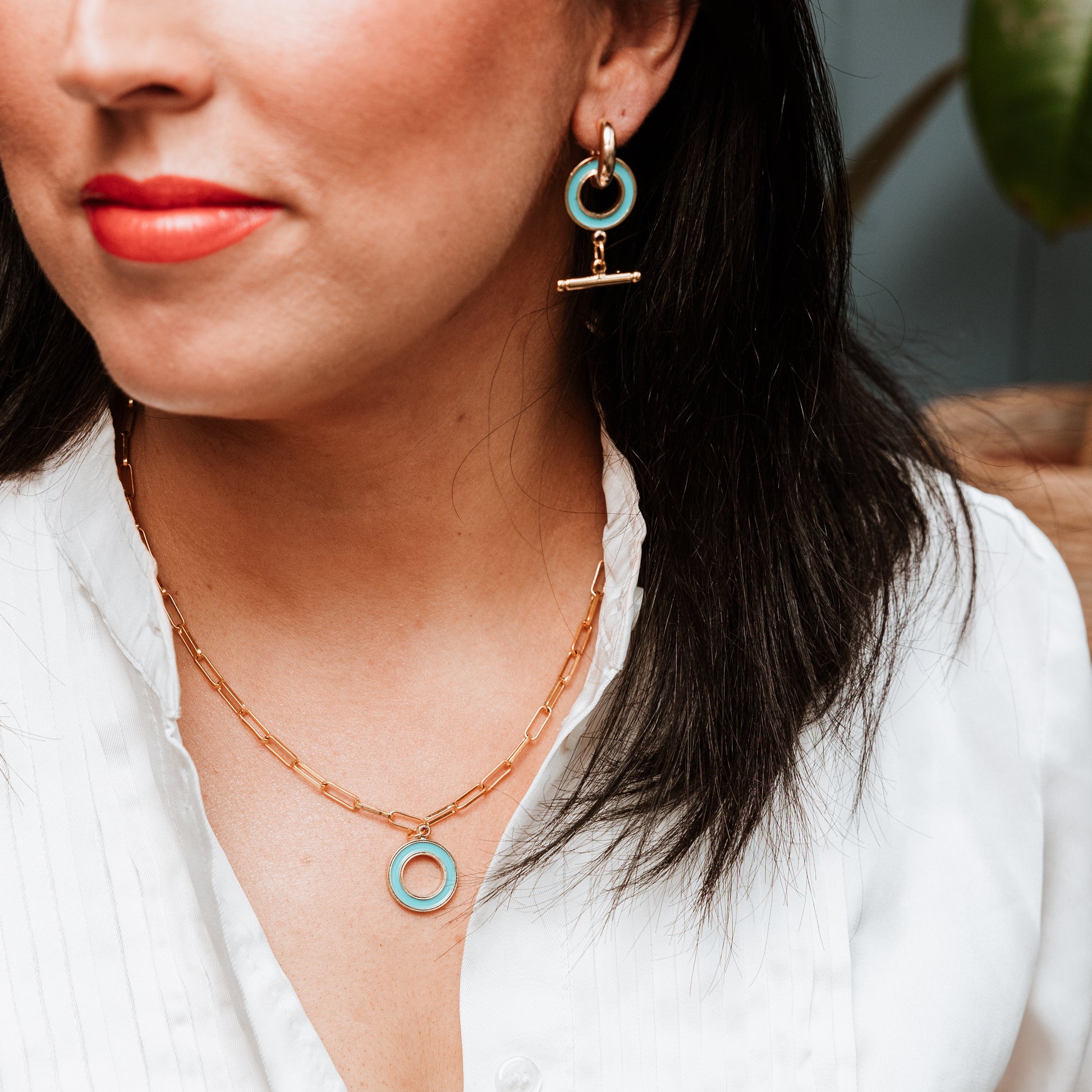 Paperclip chain with Enamel T Bar charm, woman wearing Paperclip chain with Enamel T Bar charm, enamel T-Bar, gold necklace, gold chain, gold charm. turquoise necklace, turquoise charm.
