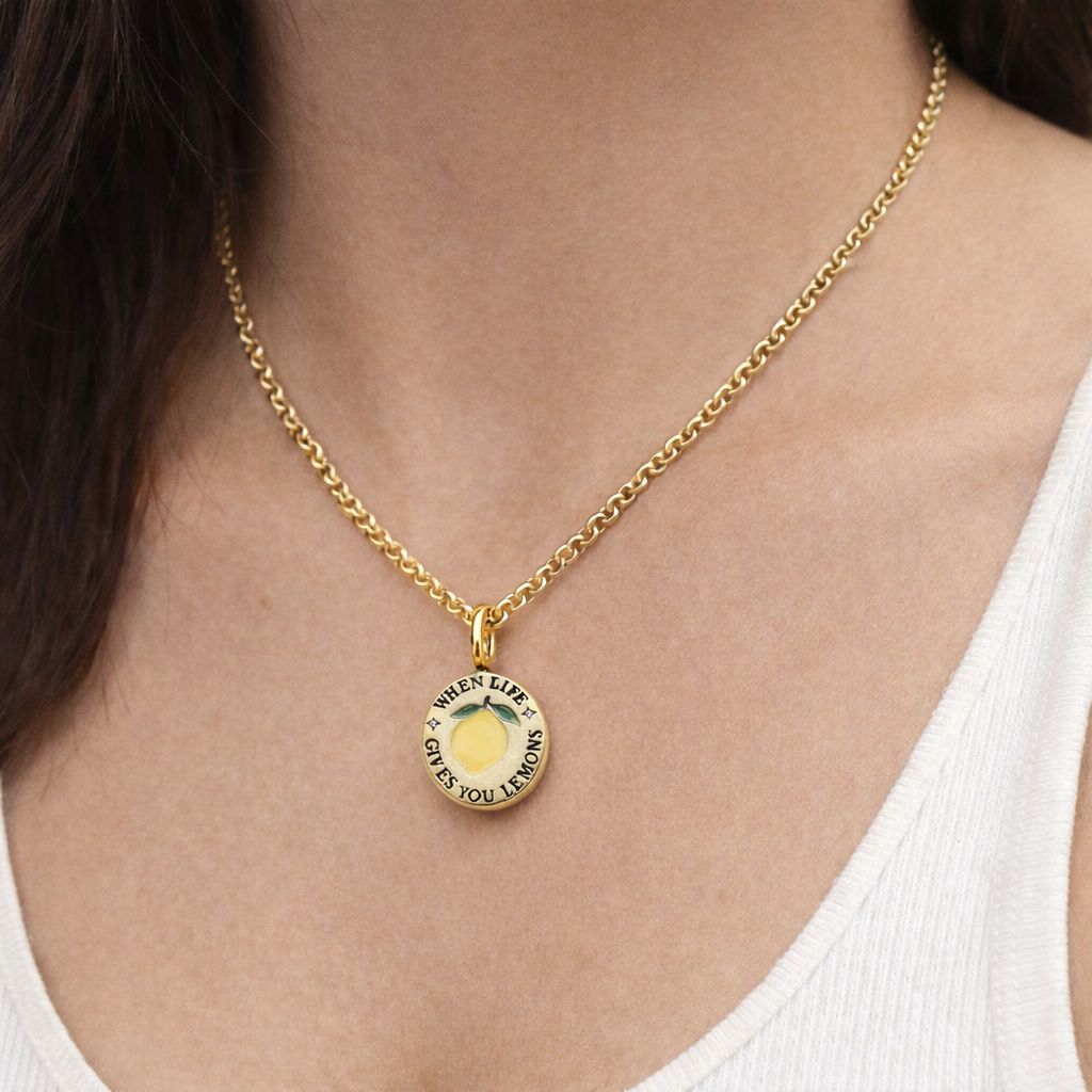 18k gold-plated pendant with ‘When Life Gives You Lemons’ engraved quote on delicate chain.
Close-up of gold-plated motivational pendant necklace with engraved quote.
'When Life Gives You Lemons’ engraved pendant necklace in gold-plated finish.