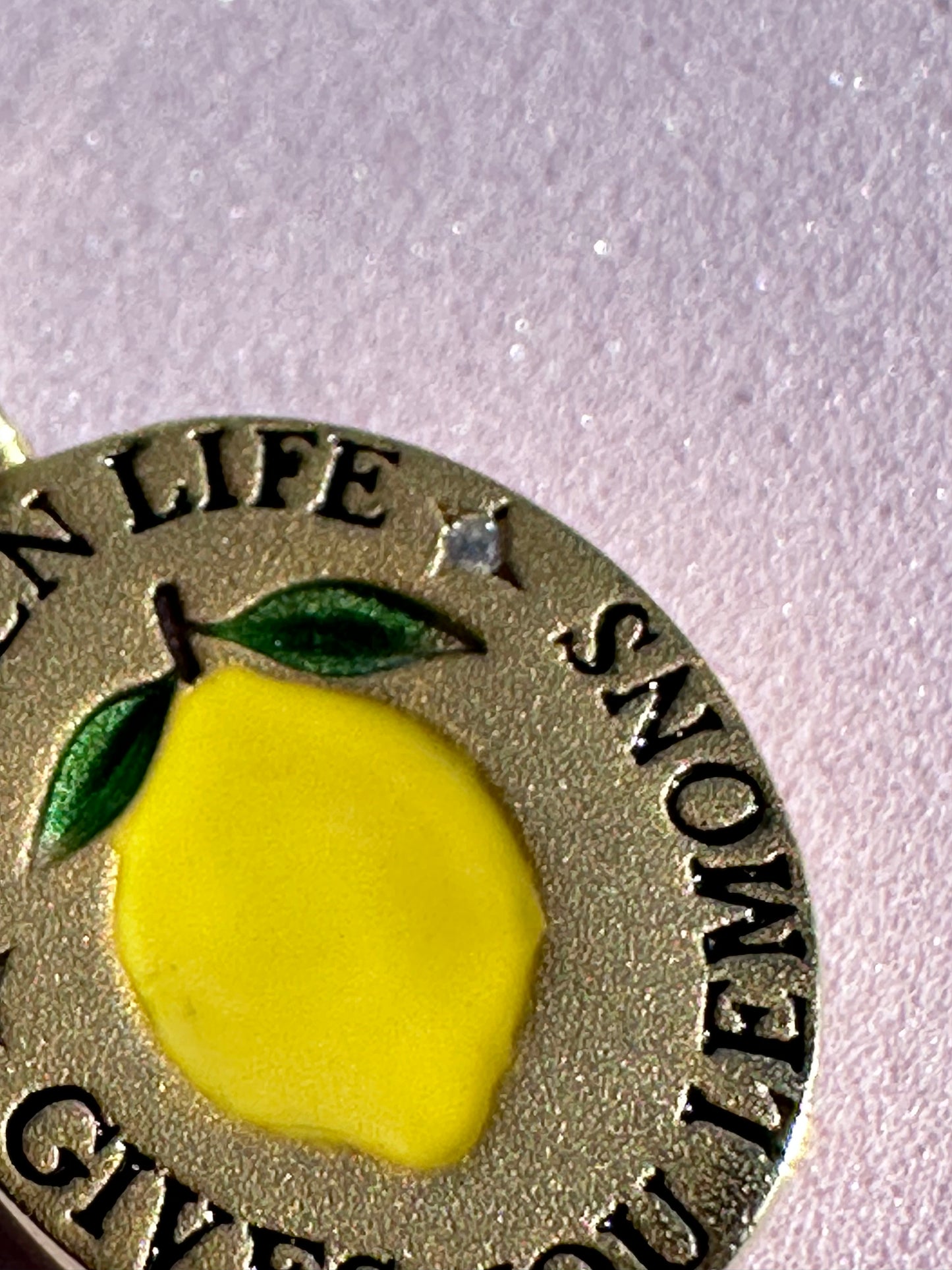 18k gold-plated pendant with ‘When Life Gives You Lemons’ engraved quote on delicate chain.
Close-up of gold-plated motivational pendant necklace with engraved quote.
'When Life Gives You Lemons’ engraved pendant necklace in gold-plated finish.