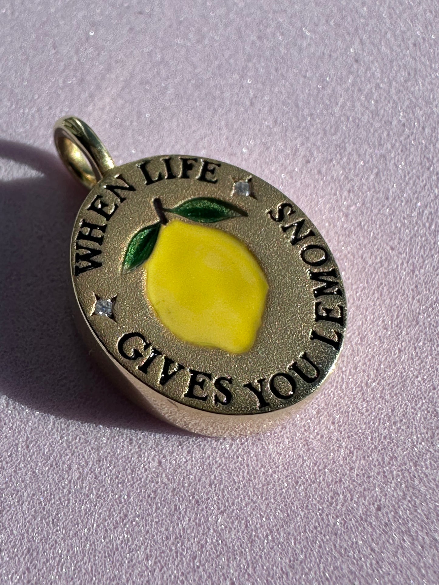 18k gold-plated pendant with ‘When Life Gives You Lemons’ engraved quote on delicate chain.
Close-up of gold-plated motivational pendant necklace with engraved quote.
'When Life Gives You Lemons’ engraved pendant necklace in gold-plated finish.